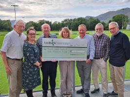 Rotarians provide funding to North Lakes Food Bank.